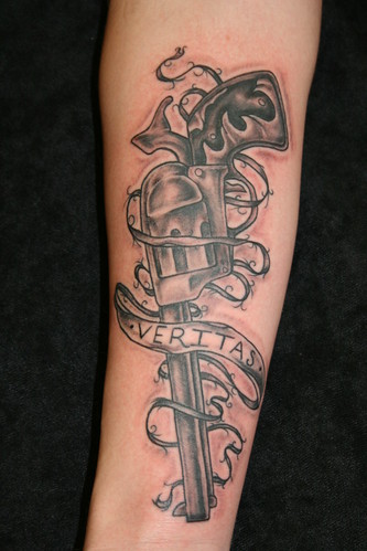 Veritas Gun Tattoo by Grinn & Barrett Tattoo. Artist: Jeremiah Connor