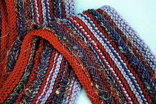 red scarves forOFA, hand knit