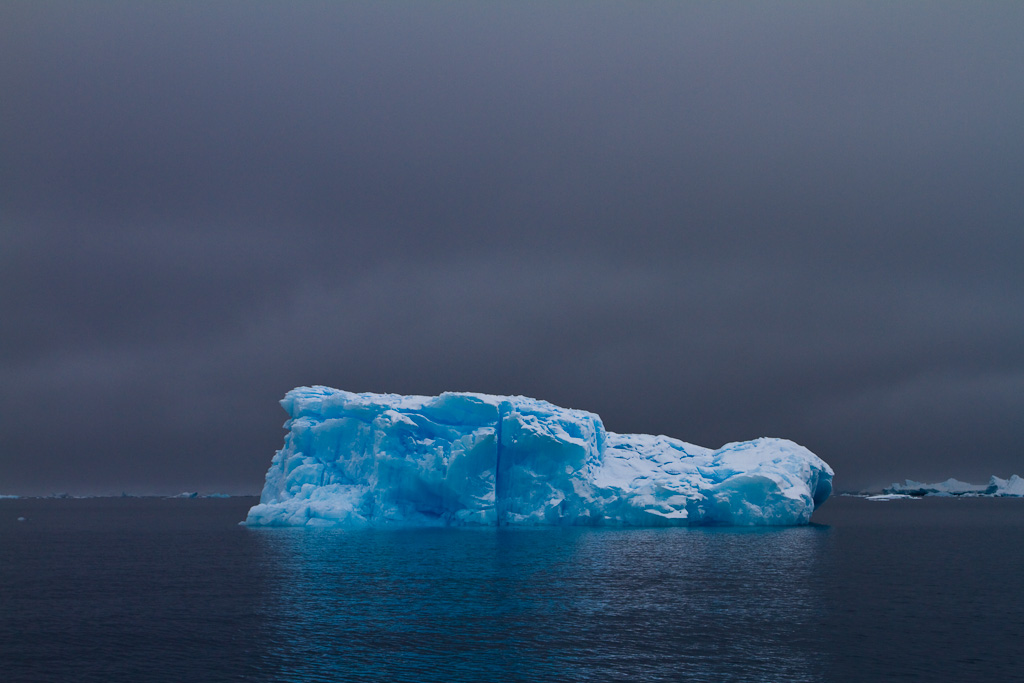 Blue Iceberg in fog