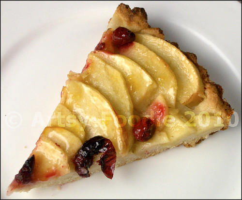 Apple tart with cranberries slice