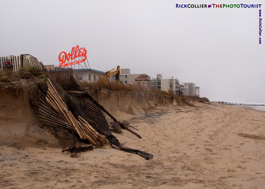 The signs of the Rehoboth Beach, Delaware, boardwalk show distantly above what remains of the carefully maintained dunes, washed out by a nor'easter spawned by the remnants of Hurricane Ida in November 2009.