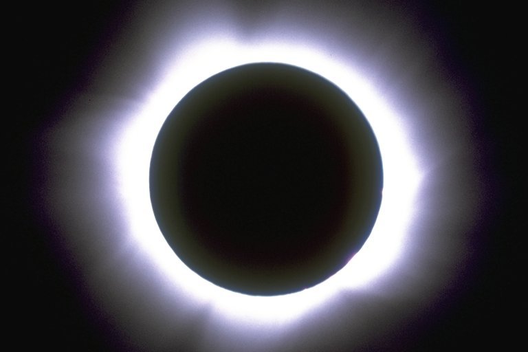 Three successively longer exposures of the eclipsed sun.
