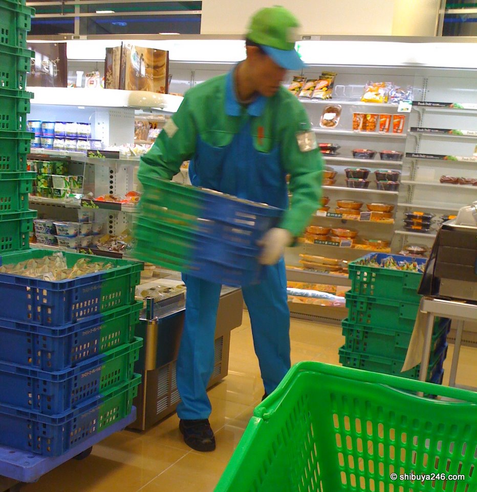 A Family Mart delivery man bringing in the fresh product to the store. Nice action shot here with the iPhone. Just the right amount of movement blur to be interesting.