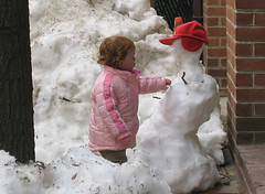 Speck fixes the neighbor's snowman, 24 months
