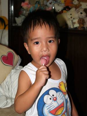 Julian eating lollypop