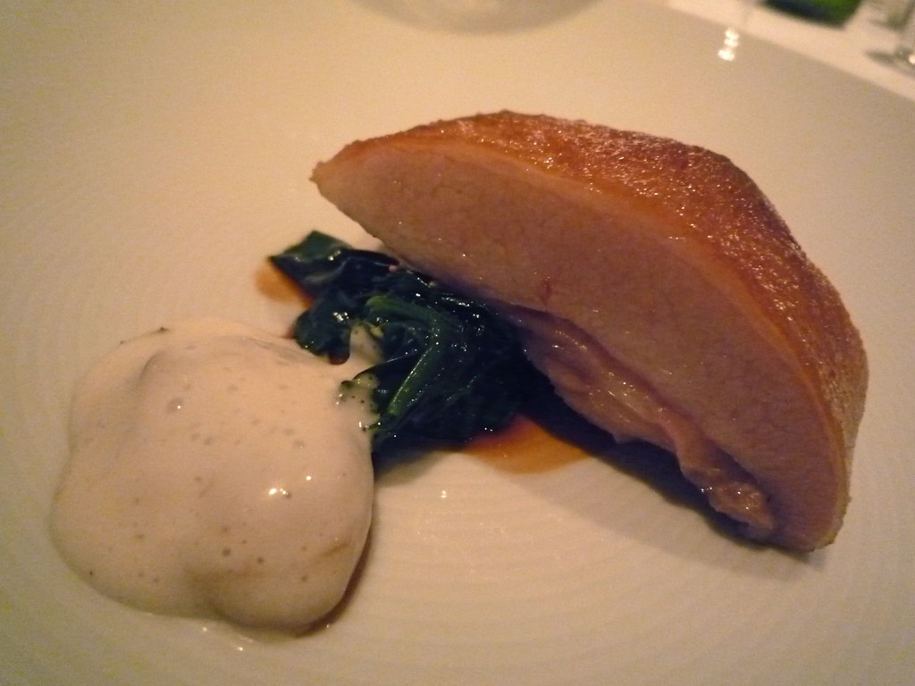 Slow cooked pork jowl with spinach and Pacific oyster