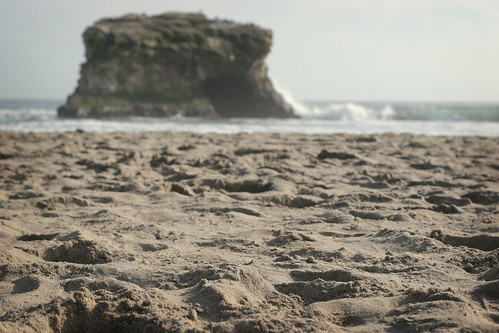 Lying in the sand at Natural Bridges