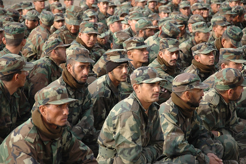 recruit military. Image by AfghanistanMatters. A group of recruits huddled outdoors in the early morning at the Kabul Military Training Centre (KMTC). 2008.
