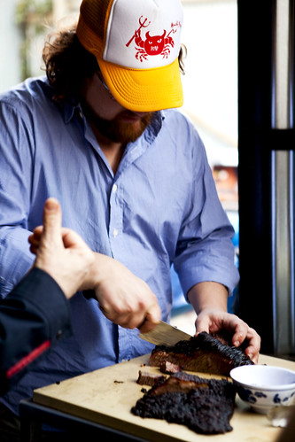 Chef/Owner of Fatty 'Cue Zakary Pelaccio cutting up brisket