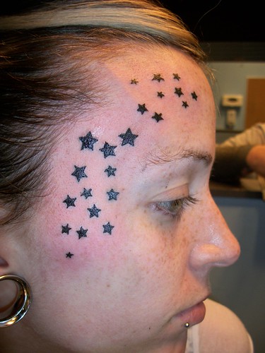 Stars On The Face Tattoo