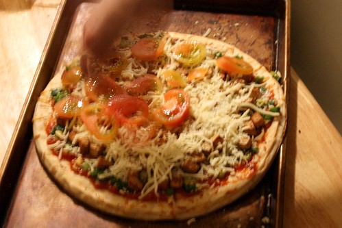 Putting Tomatoes atop the Ginger Tofu Pizza