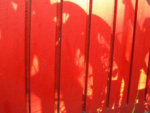 Silver Spraypaint and Shadows on Red