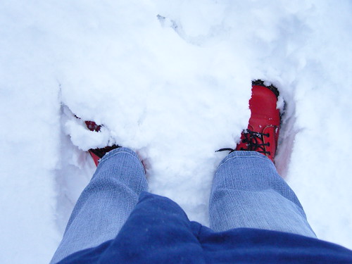Red boots in white snow