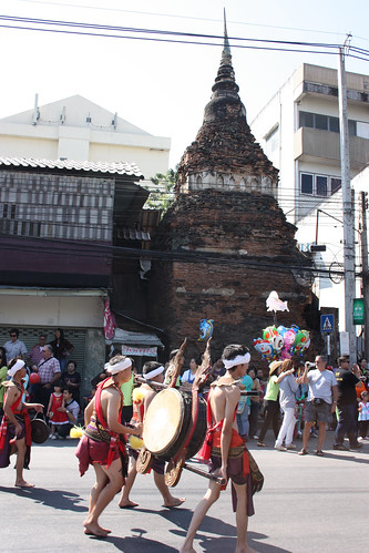 Chiang Mai Flower Festival Parade passes a Wat
