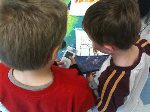 Students recording audio about a picture using an iPod