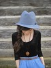 black, blue. chambray trousers and wide brimmed hats