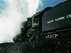 I think these are two ends of the same locomotive, probably an older NYC 2-8-2 (Mikado) type.