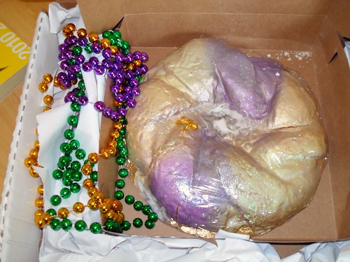king cake with mardi gras beads