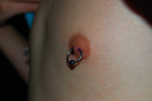 woman nipple piercing. girlfriend female nipple