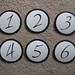 Round Black and White Circular Wedding Table Numbers <a style="margin-left:10px; font-size:0.8em;" href="http://www.flickr.com/photos/37714476@N03/4027306750/" target="_blank">@flickr</a>