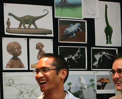 Up production designer Ricky Nierva standing in front of even more concept art from the project