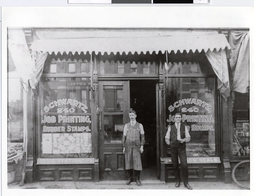 Proprietor and printer in front of Schwartz Print Shop in Minneapolis