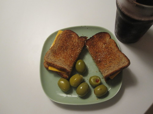 Cheese sandwich, olives, grape juice