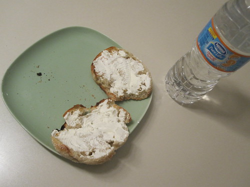 English muffin with cream cheese and orange water