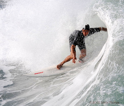 Juno Pier Beach, Florida surfing by Alida's Photos