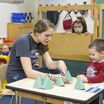 A student teaching a preschooler