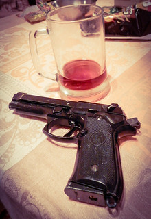 From http://www.flickr.com/photos/37441499@N07/12248801663/: Gun and alcohol