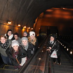 Students posing for a photo on an escalator