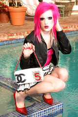 Jeffree Star by the pool with one of his favorite expensive purses