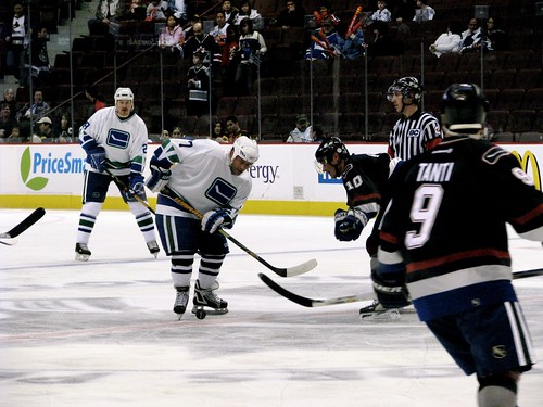 Ronning chases the puck
