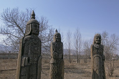 Three wooden warriors