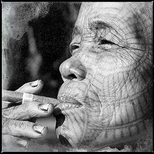 23 chin woman smoking cheroot, north west burma