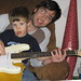 Christopher teaching Xavier guitar