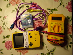 Gameboy color, flash cartridge, Gamelink cable and multimeter