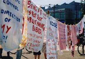 Banners at a women's health demonstration. Image courtesy of the Vancouver Women's Health Collective.