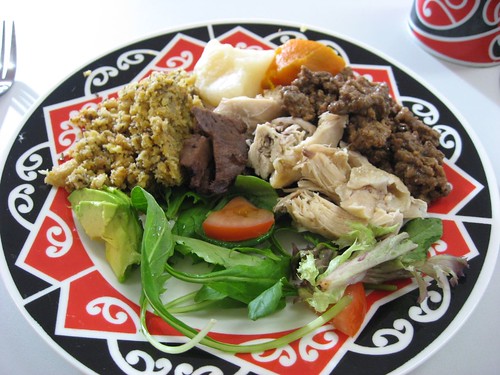 Maori meal - stuffing, mutton, chicken, beef, sweet potatoes, salad