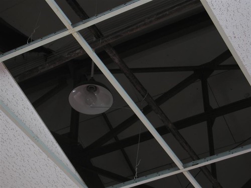 Old lamp behind drop ceiling