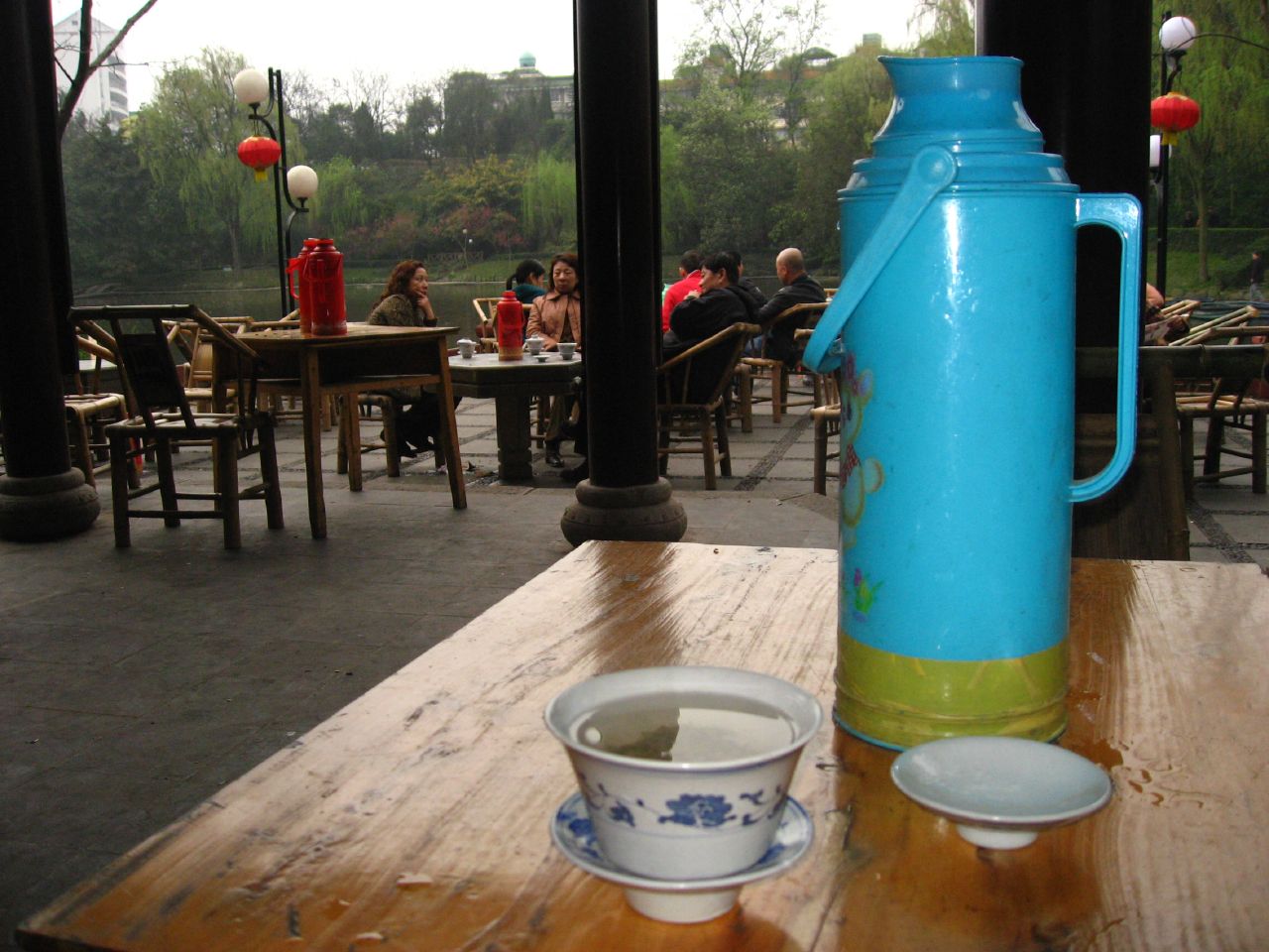 Large thermuses of hot water are given to customers who order tea in the People's Park of Chengdu, China.