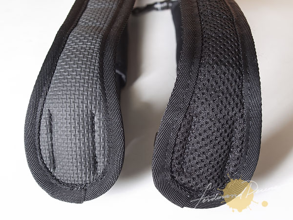 PacSafe CarrySafe 100 neck strap (new version on the left with added non-slip grip pad)