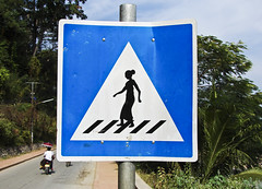 Women with sarongs crossing