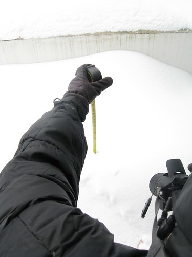 My big geek taking a photo of a snow measurement