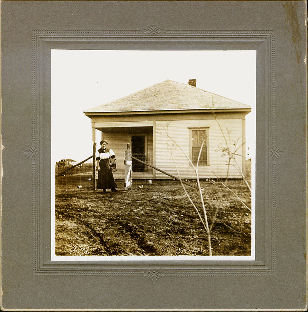 Woman in front of house