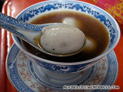 Glutinous riceball with black sesame filling, served in ginger soup