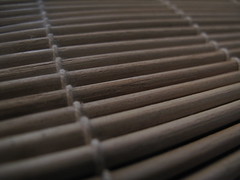 Rounded-side sticks on sushi mat