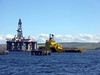 Tugs moving an oil rig near in Invergorden