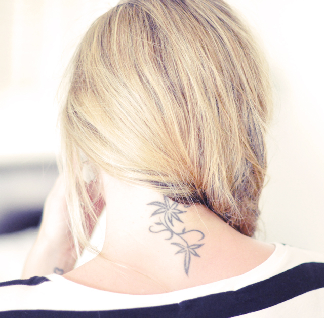 Back of Fishtail and floral neck tattoo  